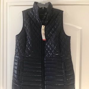 Mid thigh length quilted vest